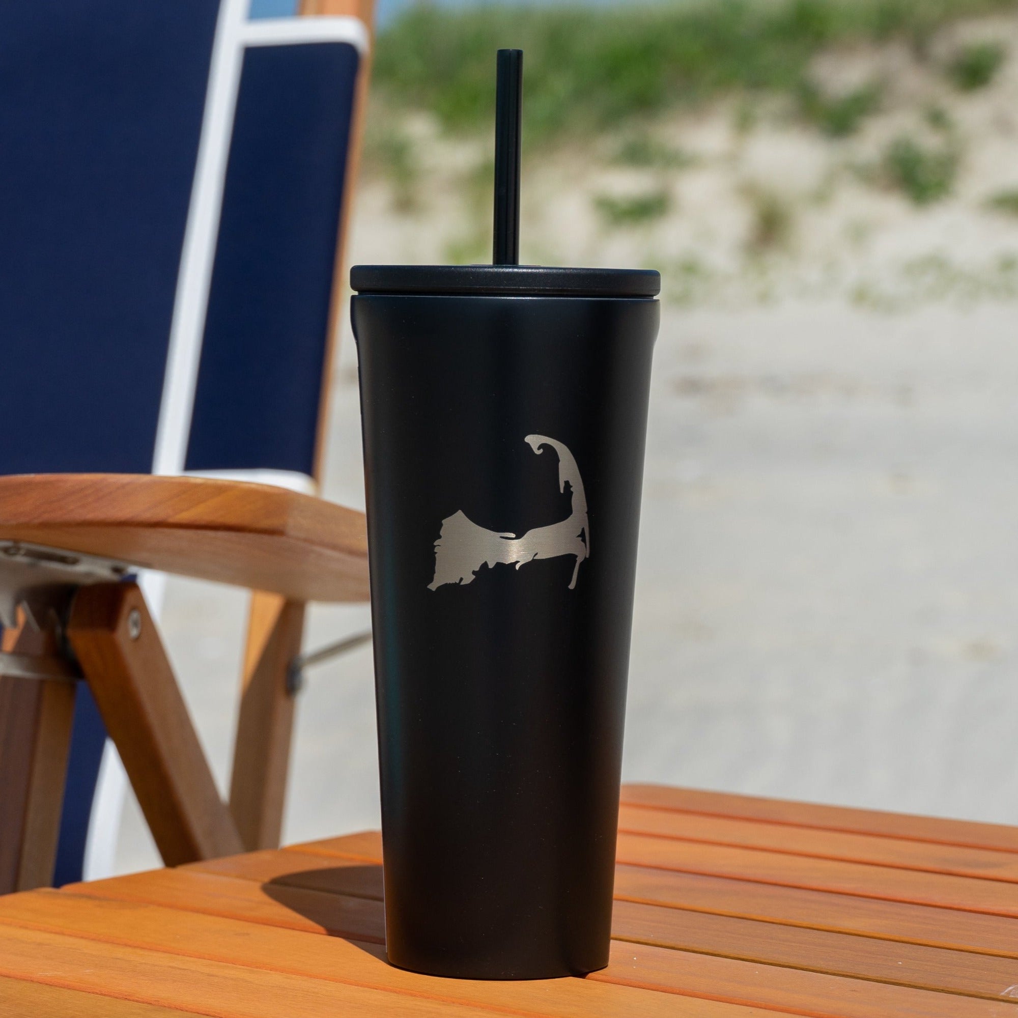 Black cape cod drinkware on wood beach table