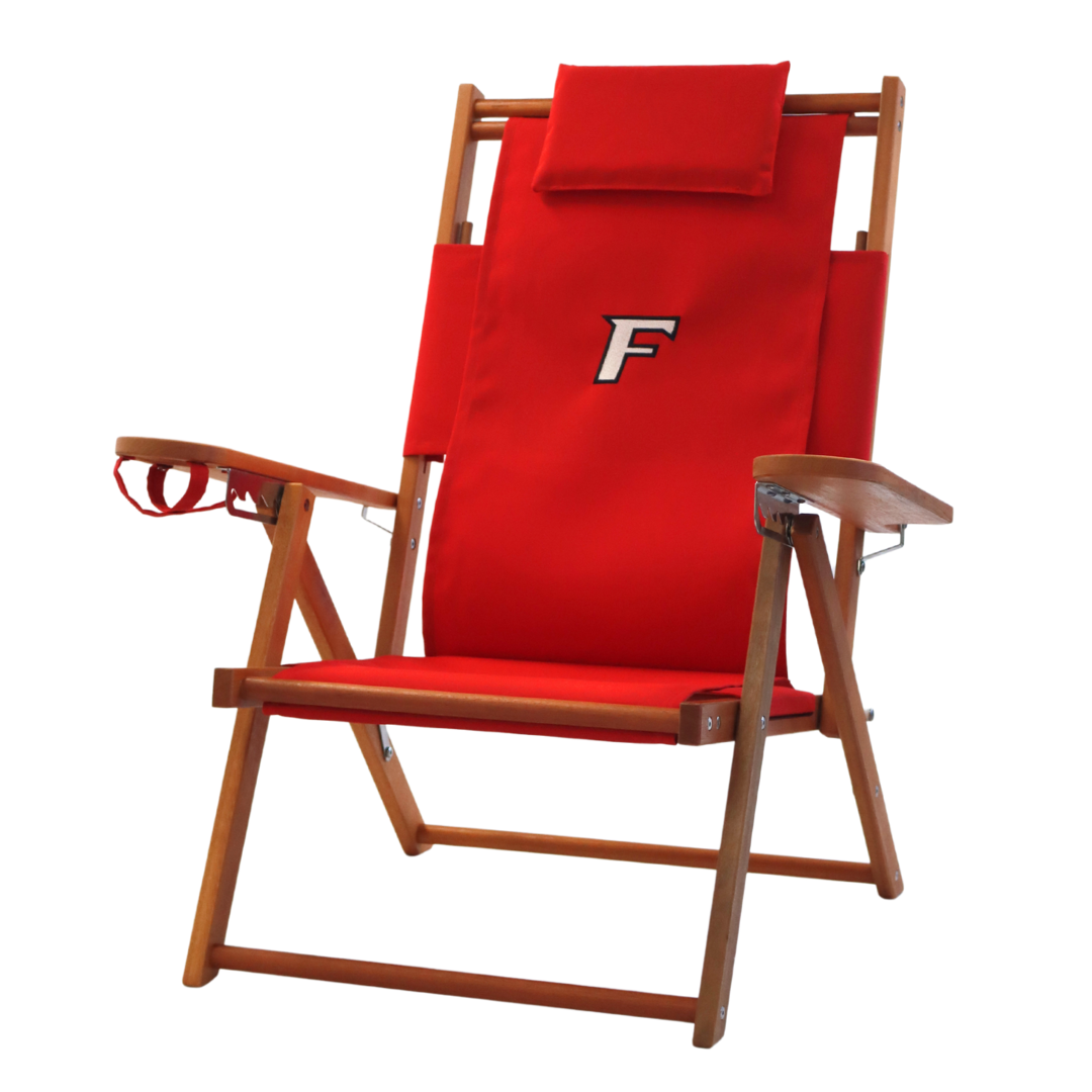 A red beach chair with embroidered Fairfield University logo.
