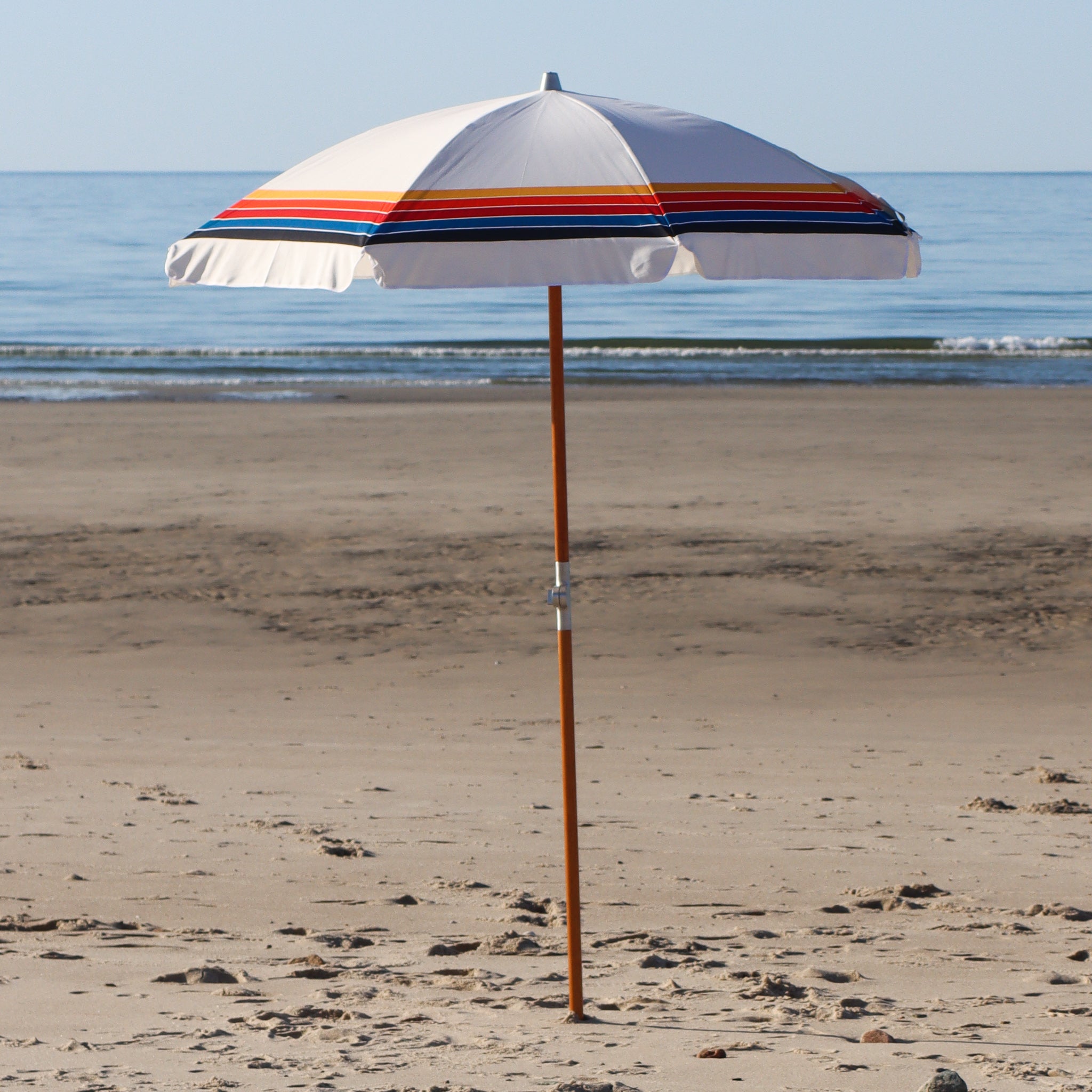 white beach umbrella with stripes
