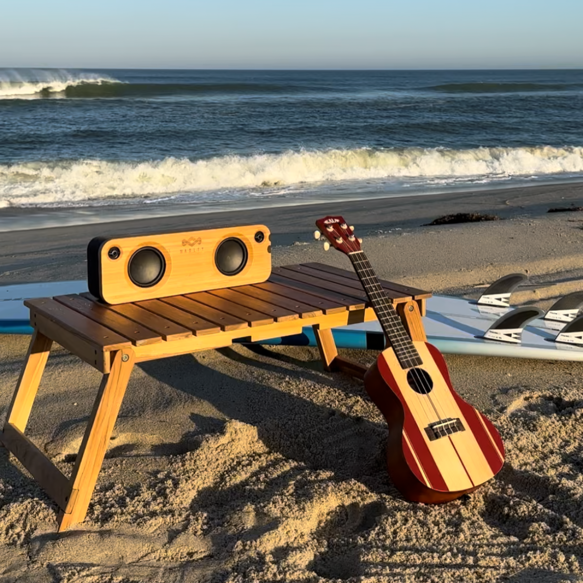 Folding Teak Beach Table with Ukulele Radio Surfboard and Crashing Waves