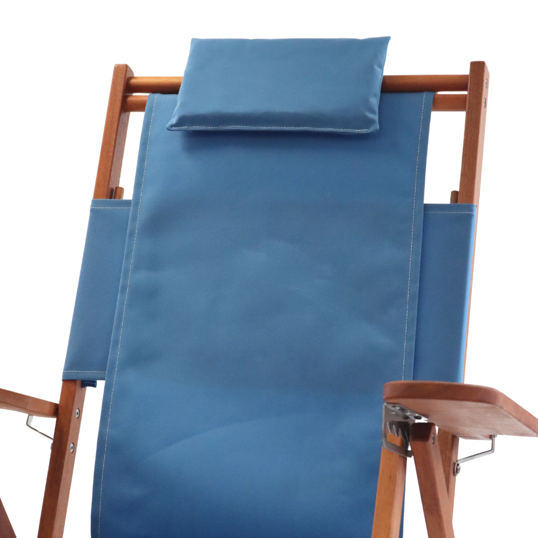 Blue lounge chair with wooden frame and pillow headrest