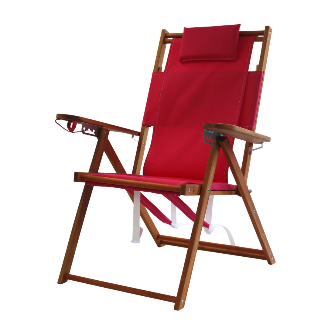 Pink folding backpack beach chair with wooden frame on a white background