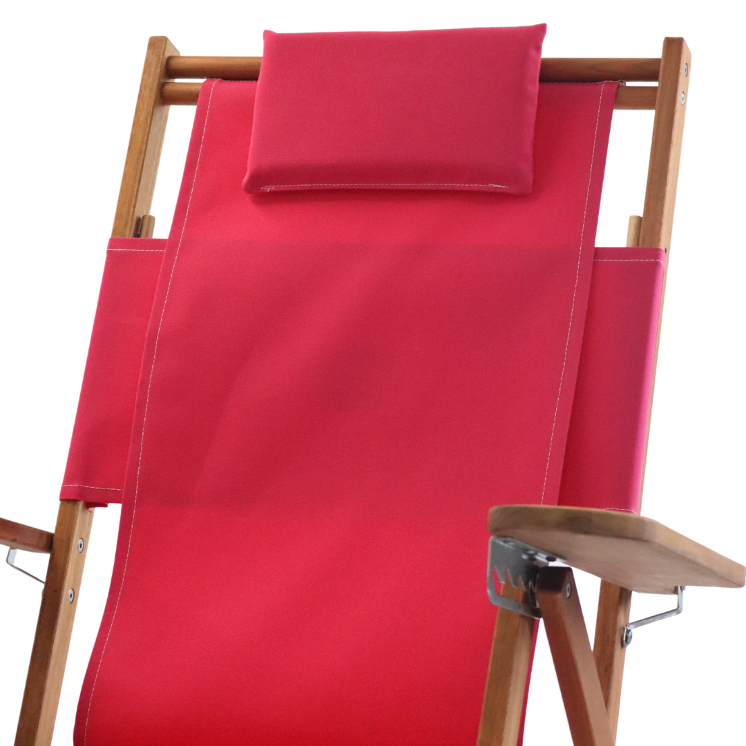 Tall pink backpack beach chair with wood frame and pillow headrest