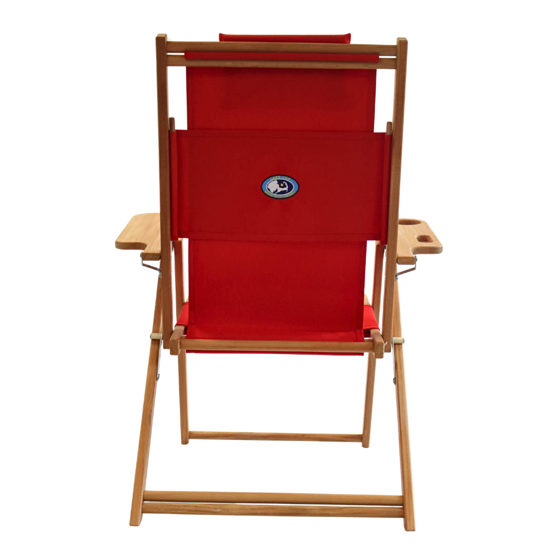 Red folding chair with wooden frame on a white background