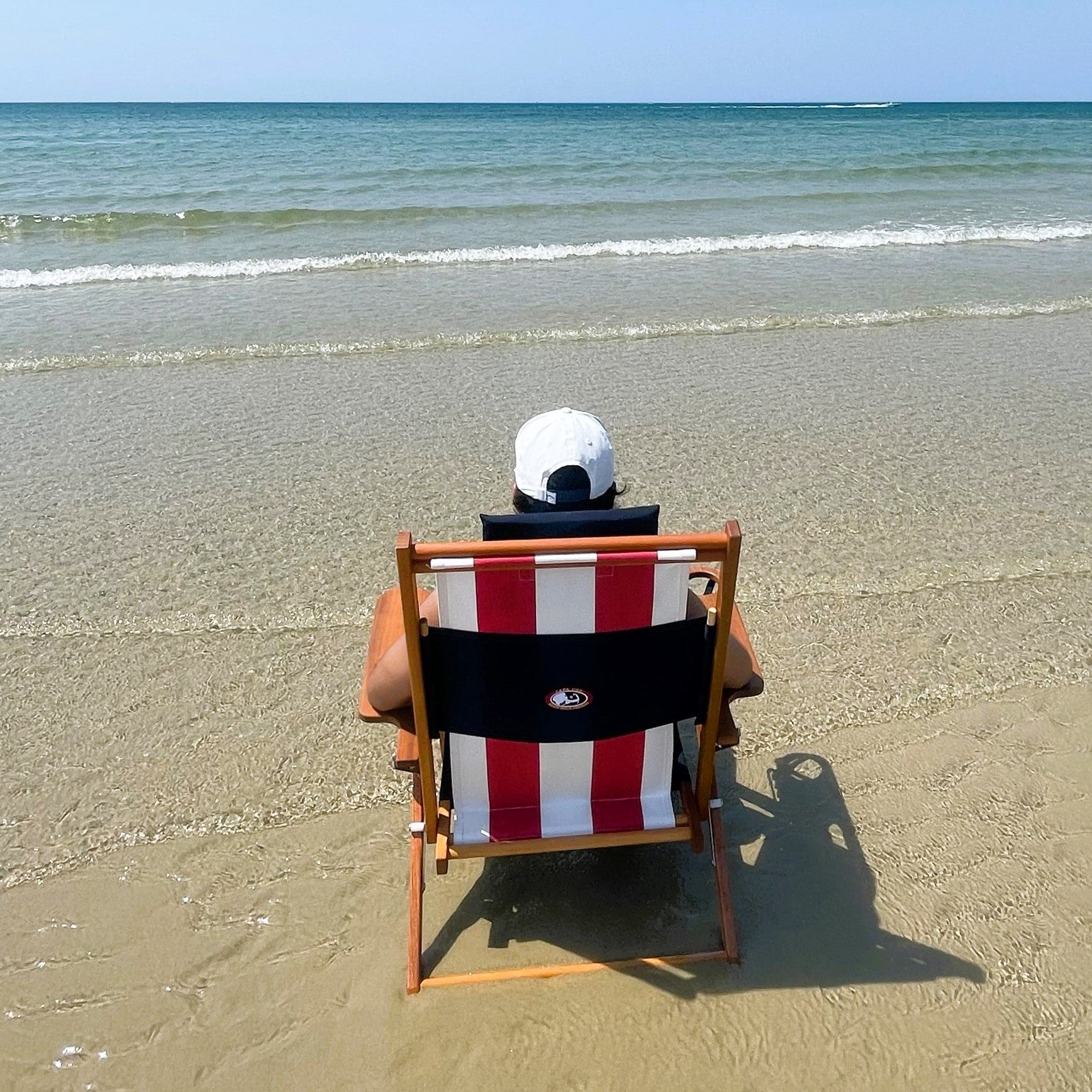 All AmericannRed White and Blue Wood Beach Chair in Water at Low Tide on Cape Cod