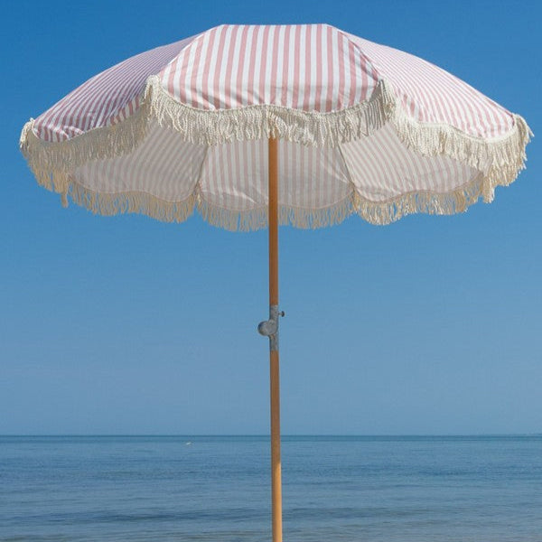 coral pink and white stripe umbrella with tassels