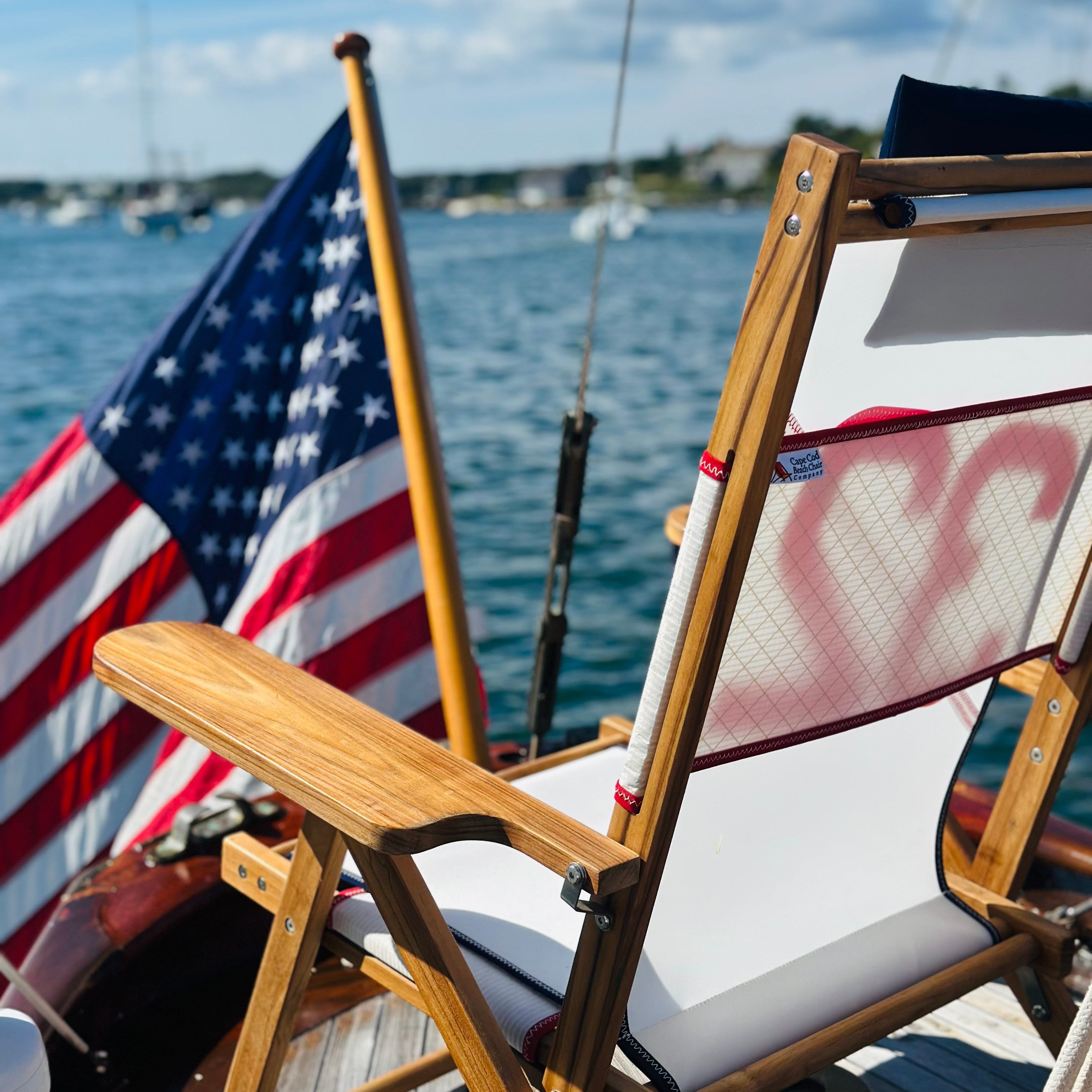 A gorgeous chair made with teak and sailcloth on a boat in Chatham, Cape Cod.