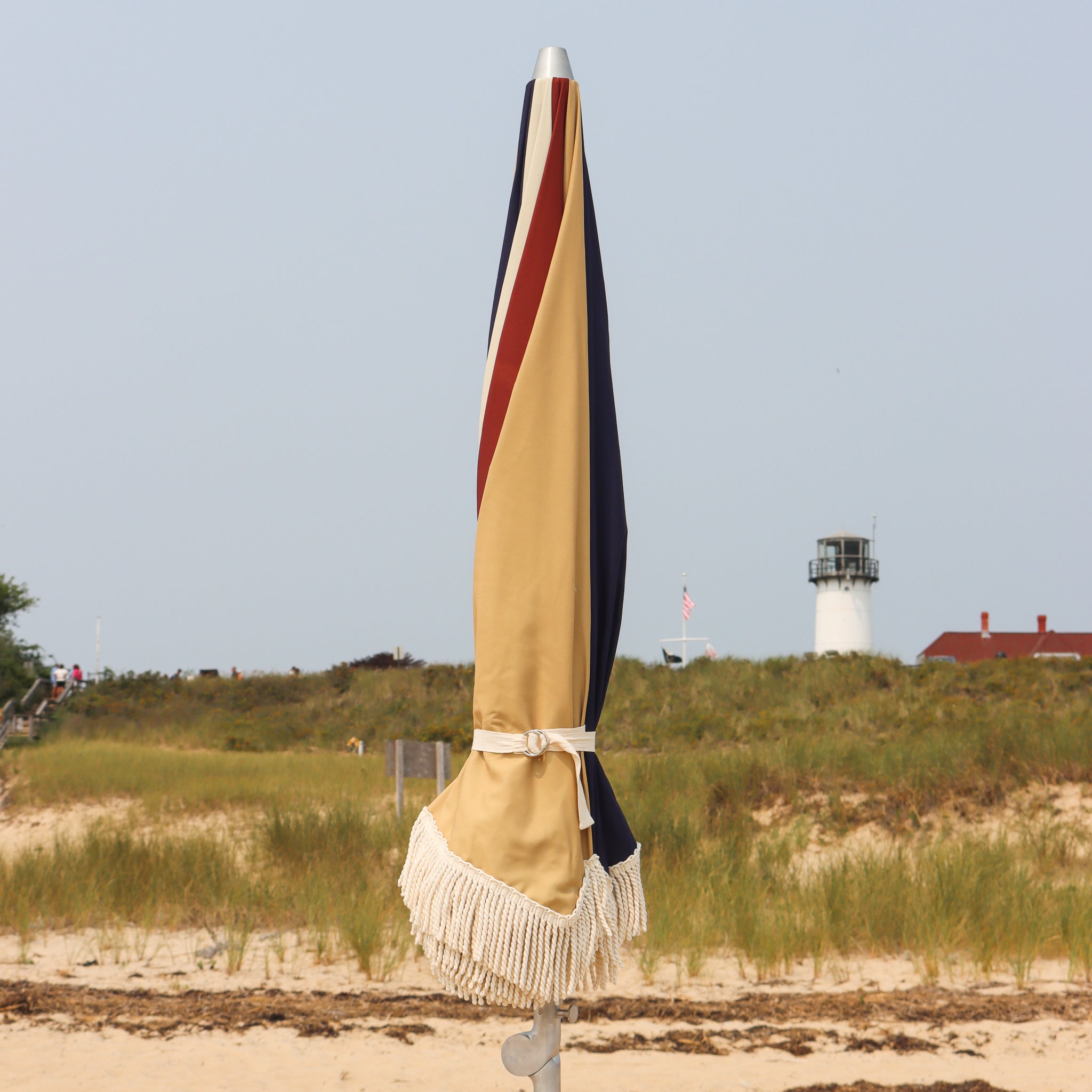 Umbrella with cinch tie and cotton fringe in Chatham Cape Cod
