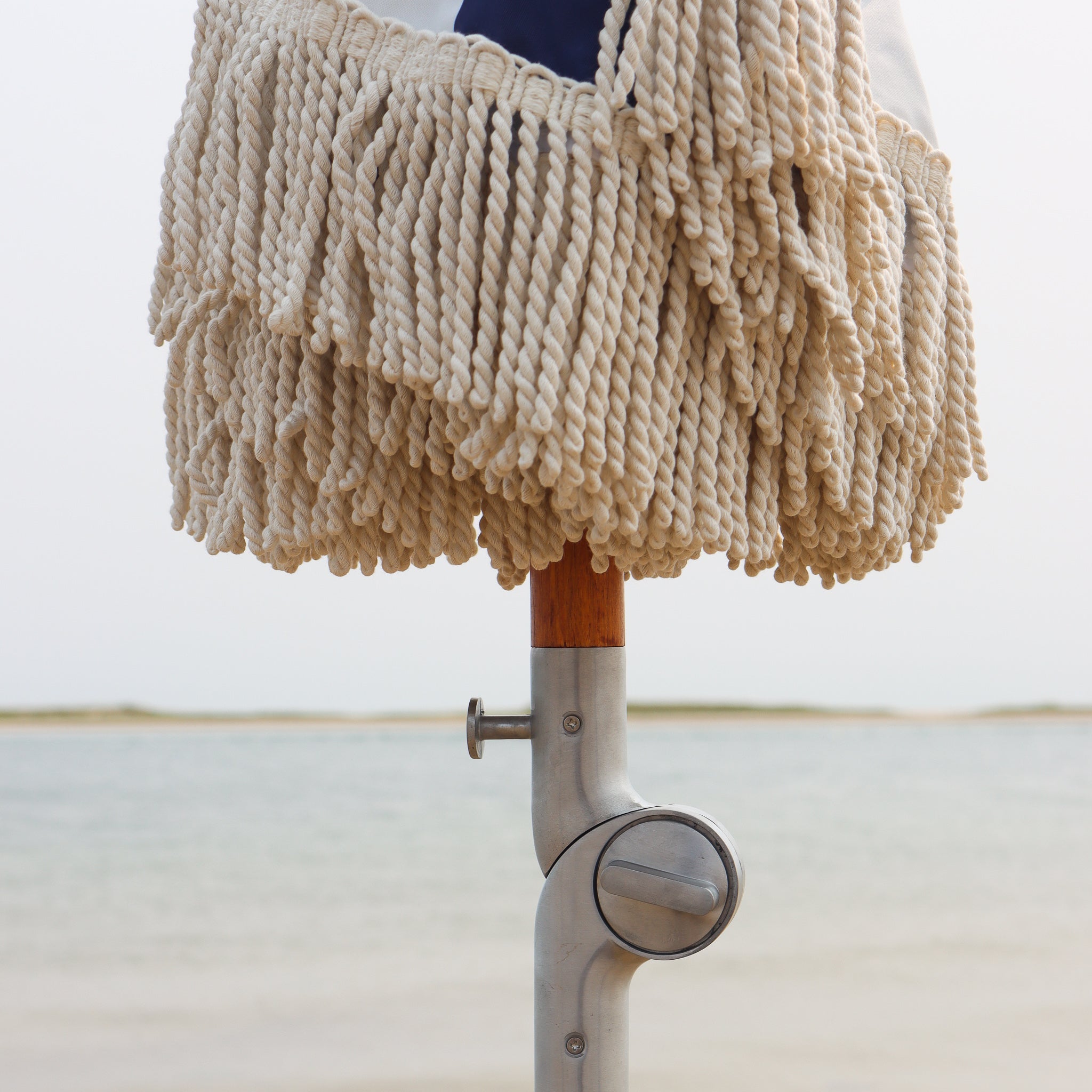 Aluminum tilt mechanism to adjust umbrella and cotton fringe