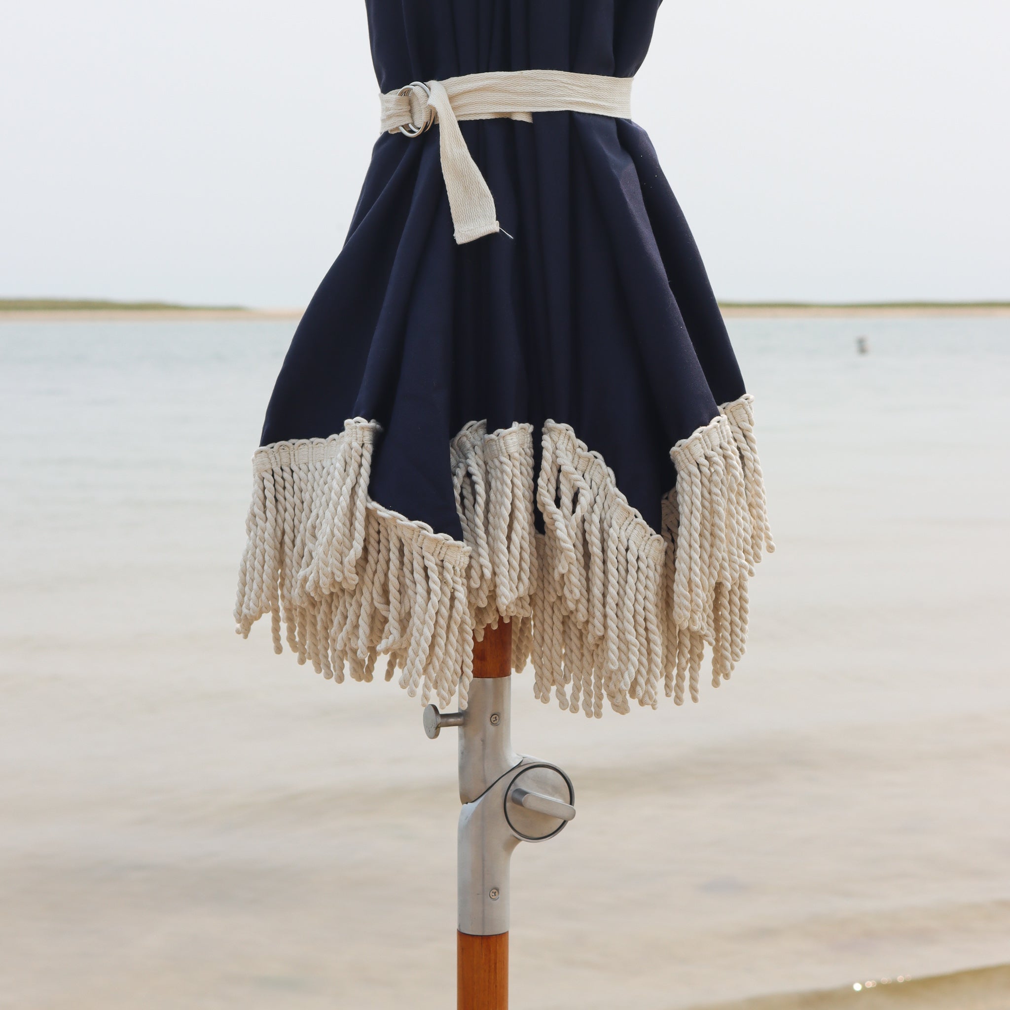 Premium umbrella with cinch tie, cotton fringe and tilt mechanism
