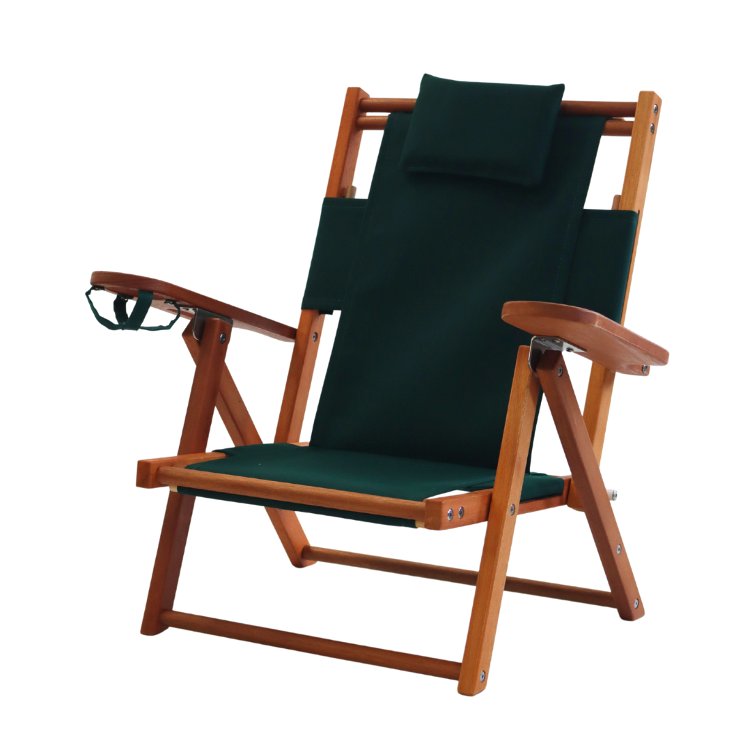 Kid's wooden beach chair with green fabric on a white background