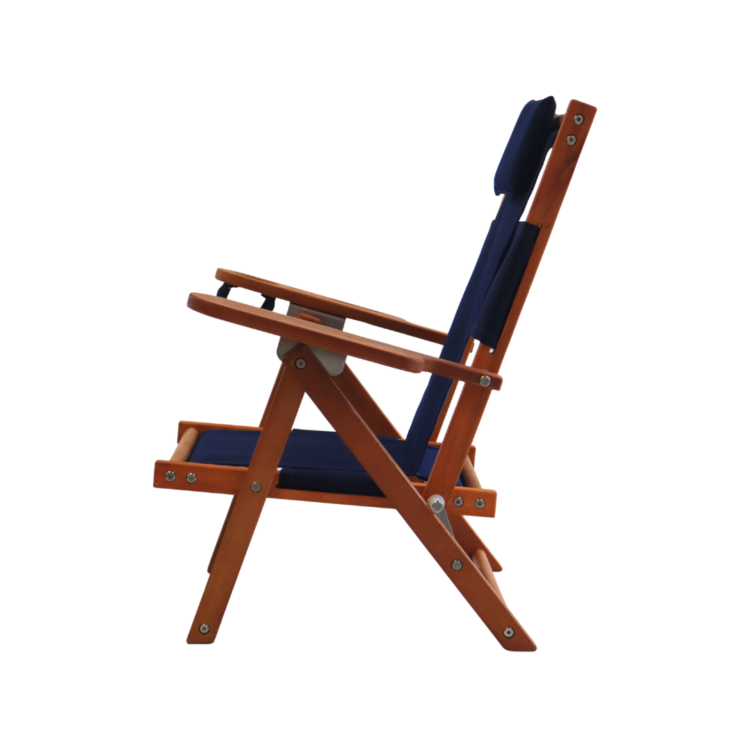 Kid's wooden folding beach chair with navy blue cushions on a white background