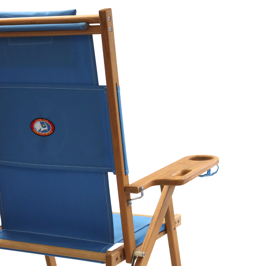 Blue folding chair with wooden armrest and cupholder