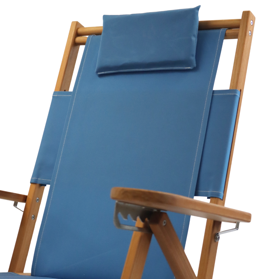 Light blue lounge chair with wooden frame and pillow headrest