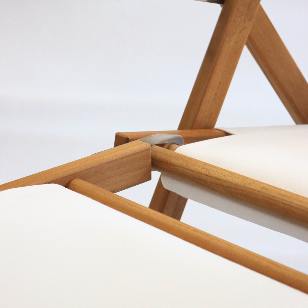 Wooden beach chair with white canvas and footrest attachment