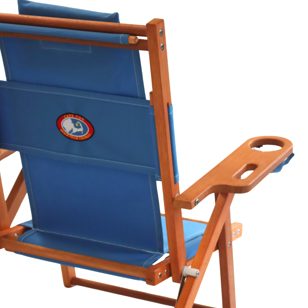 Light blue folding chair with wooden frame and logo on a white background
