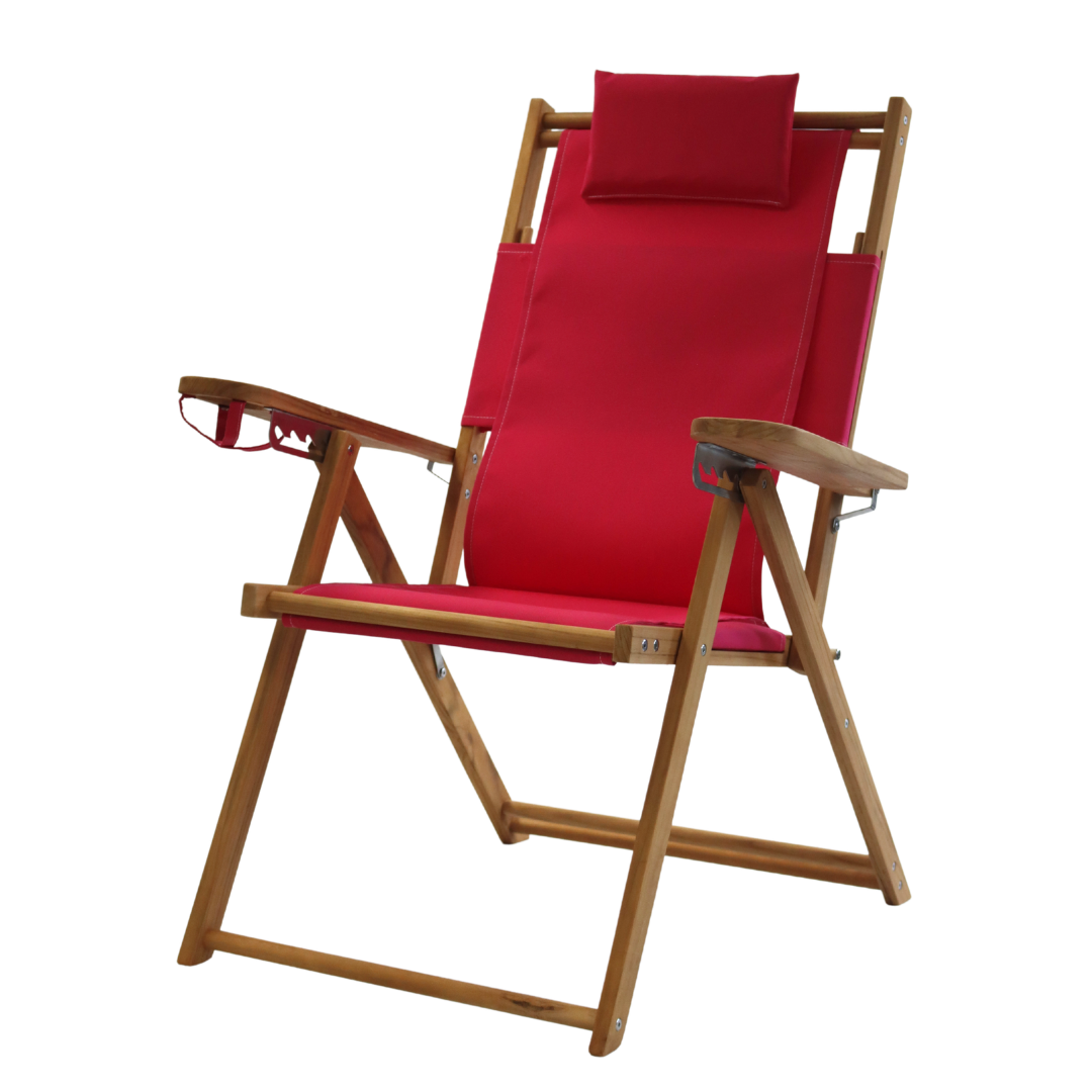 Pink folding chair with wooden frame on a white background