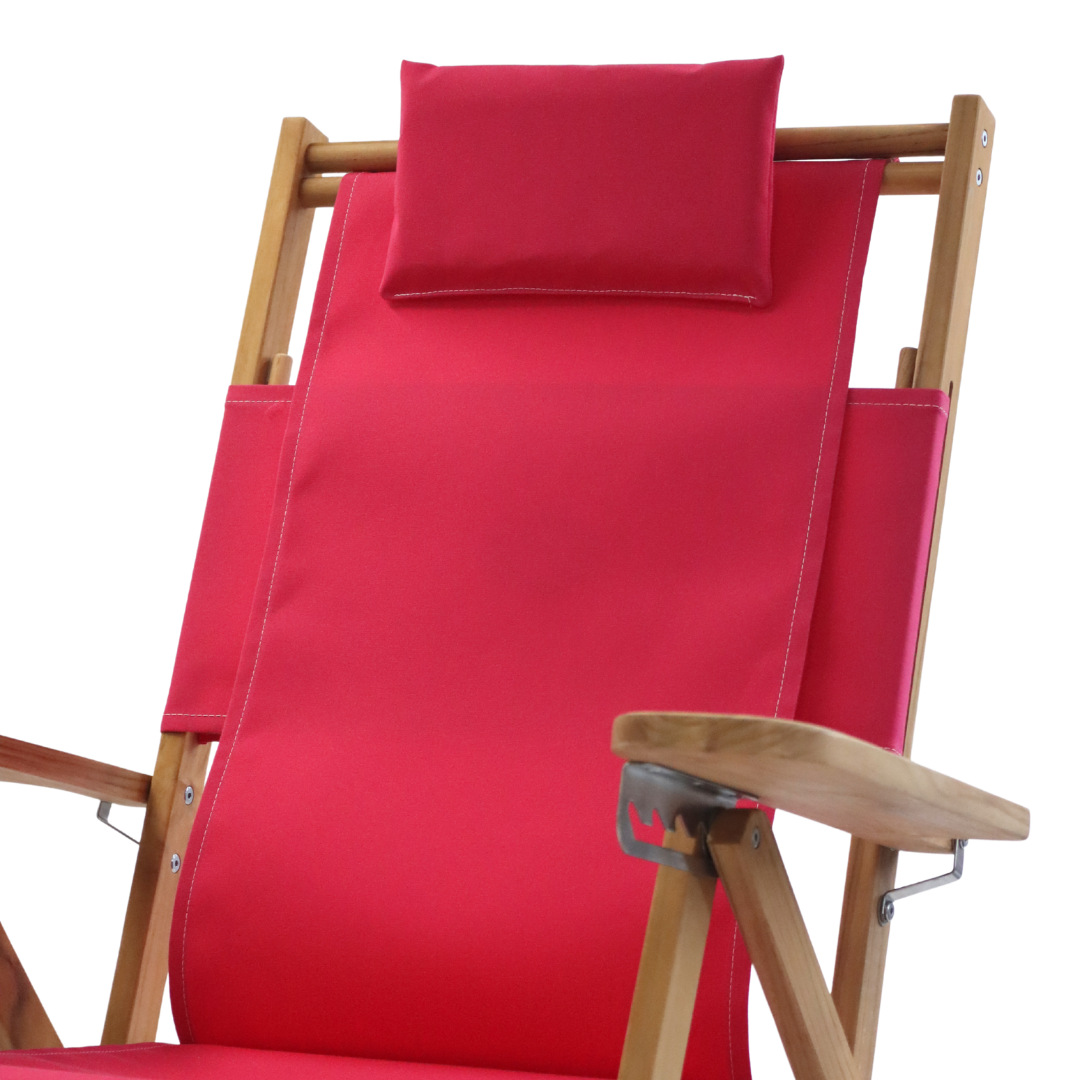 Pink beach chair with wooden frame and adjustable head pillow