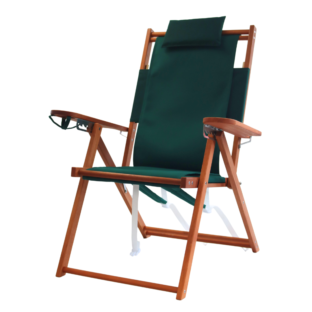 Green deck chair with wooden frame and backpack straps
