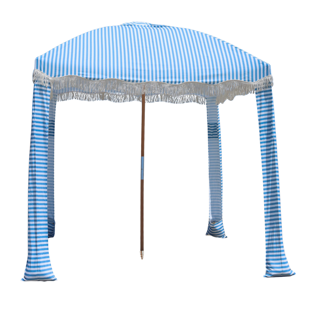 A light blue and white striped portable beach cabana.