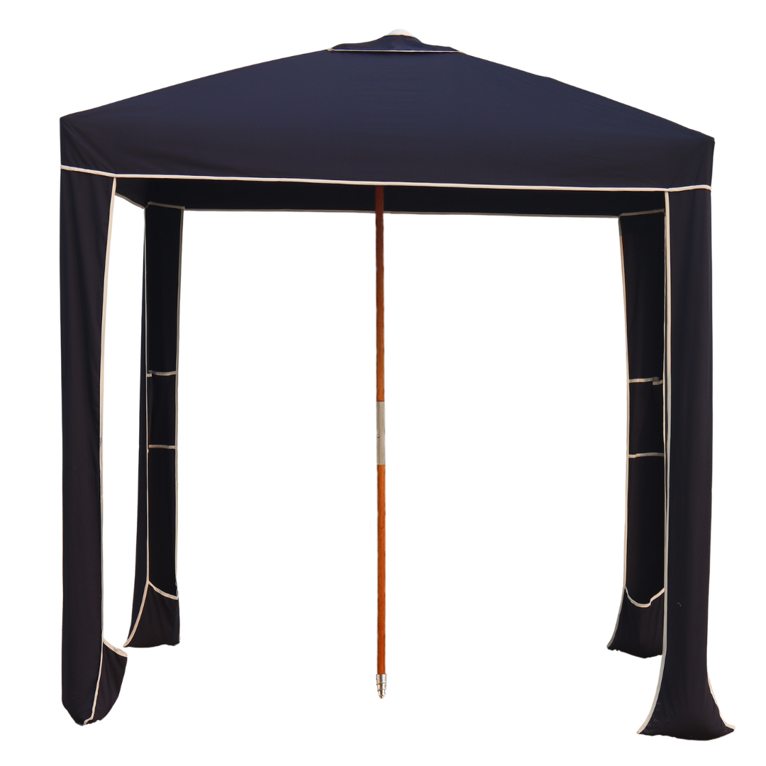 A navy blue luxury beach cabana with a white background.